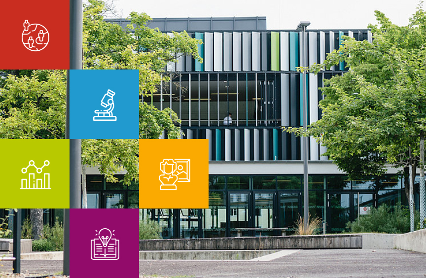 Schulgebäude der Neuen Schule Wolfsburg mit farbigen Themenkacheln und Icons