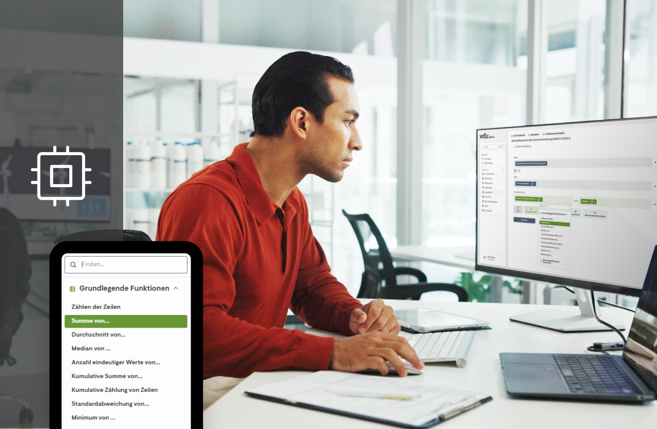 Mann arbeitet im Büro an einer webbasierten Statistikplattform mit Diagramm- und Filterfunktionen auf dem Monitor.
